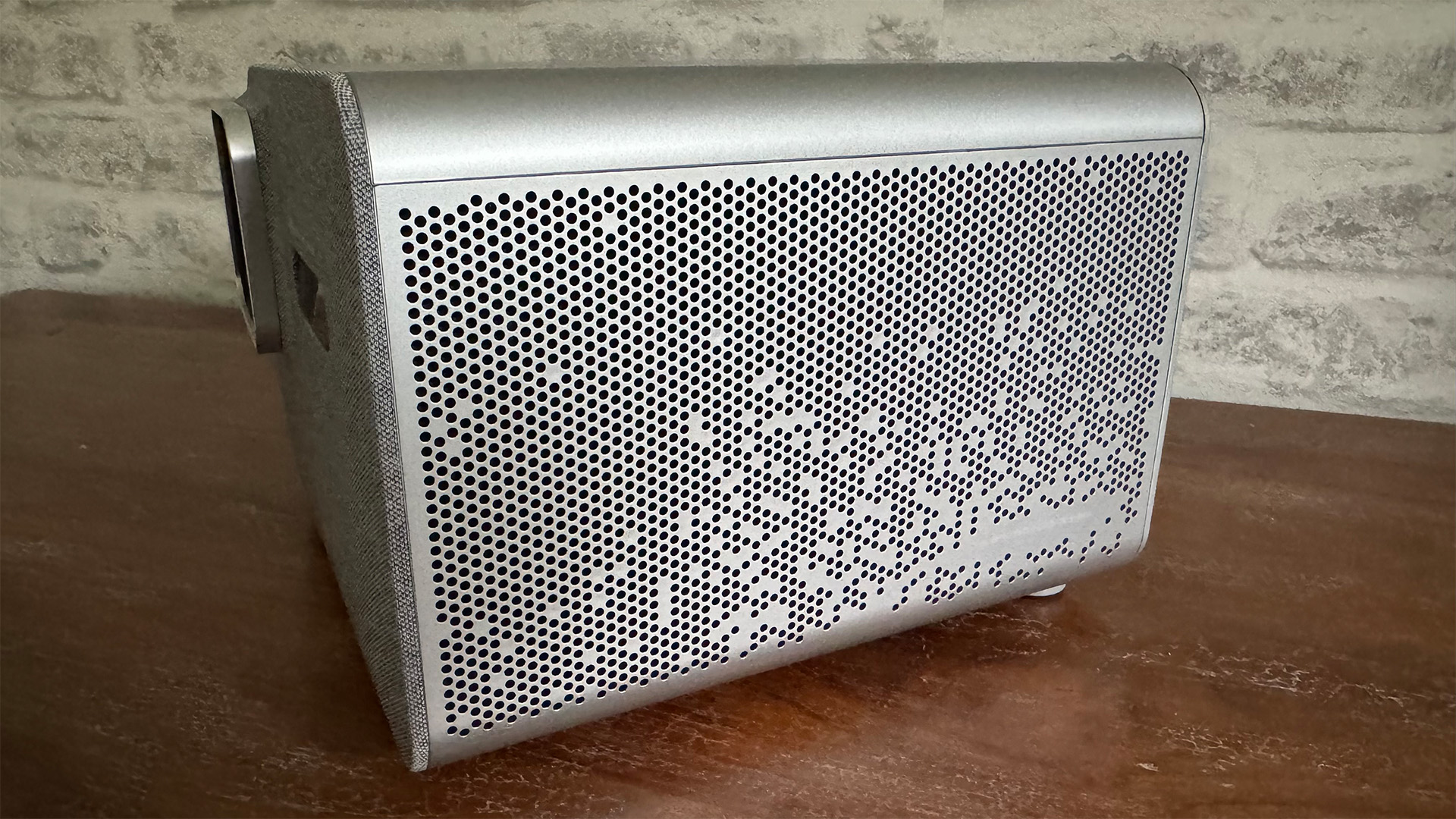 BenQ TK705i home cinema projector, side of unit showing speaker grille