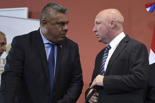 Argentine Sports Secretary and former footballer Carlos Mac Allister (right) speaks to Argentine Football Association president Claudio Tapia in 2018.