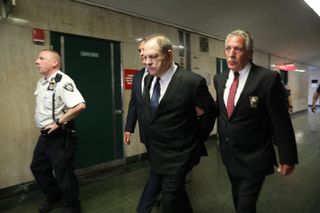 NEW YORK, NY - JULY 09: Harvey Weinstein is escorted in handcuffs into State Supreme Court after on Monday for arraignment on charges alleging he committed a sex crime against a third woman on July 9, 2018 in New York City. The former movie producer was previously indicted on charges involving two women. Weinstein, 66, has been accused by dozens of other women of forcing them into sexual acts using both pressure and threats. Weinstein has denied all allegations of non-consensual sexual activity and is currently free after posting $1 million cash bail. (Photo by Spencer Platt/Getty Images)