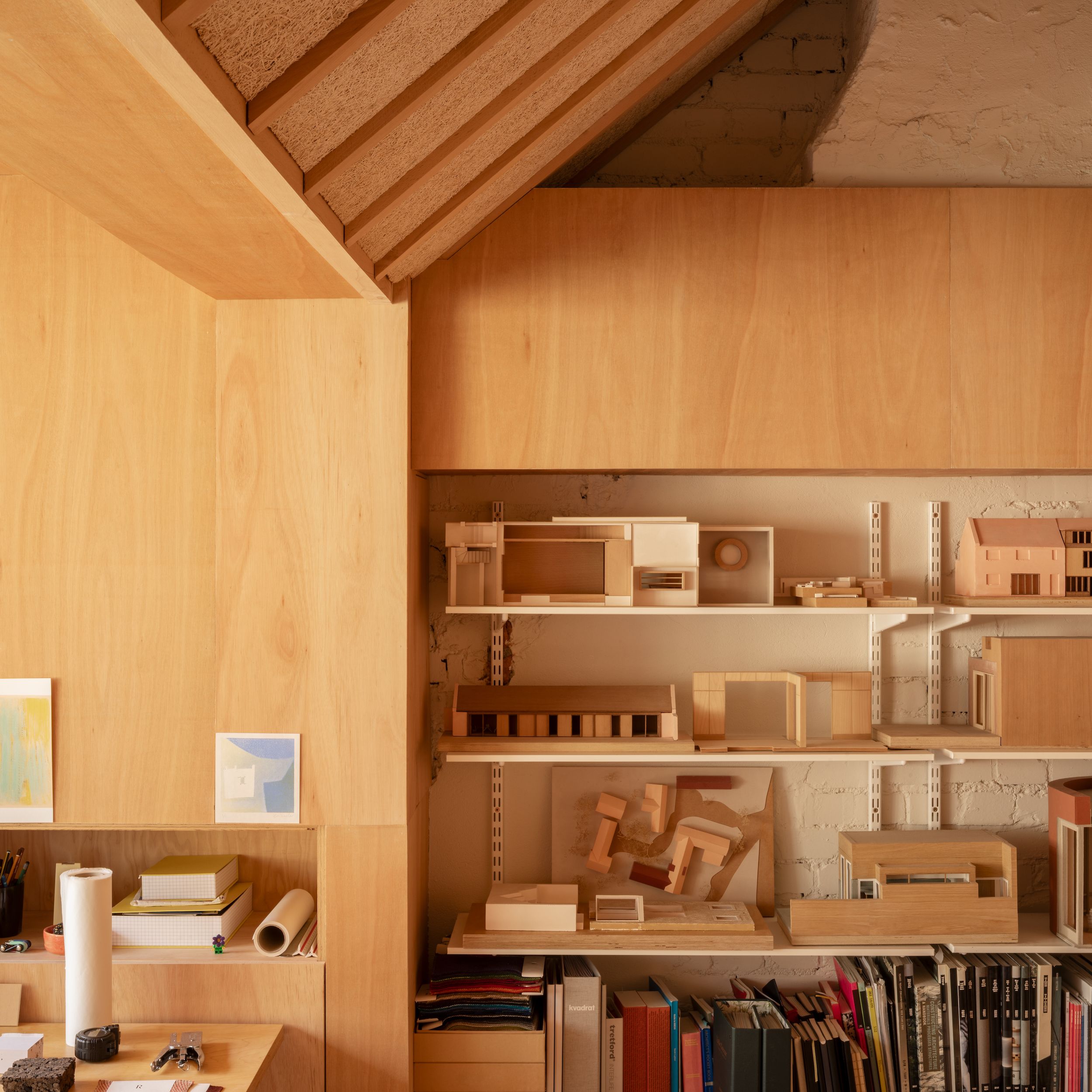 Details of a sun-filled London home with wooden surfaces, period details, including a fireplace, and plenty of collectibles.