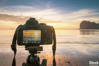 DSLR Camera at the Beach, by Teradat Santivivut