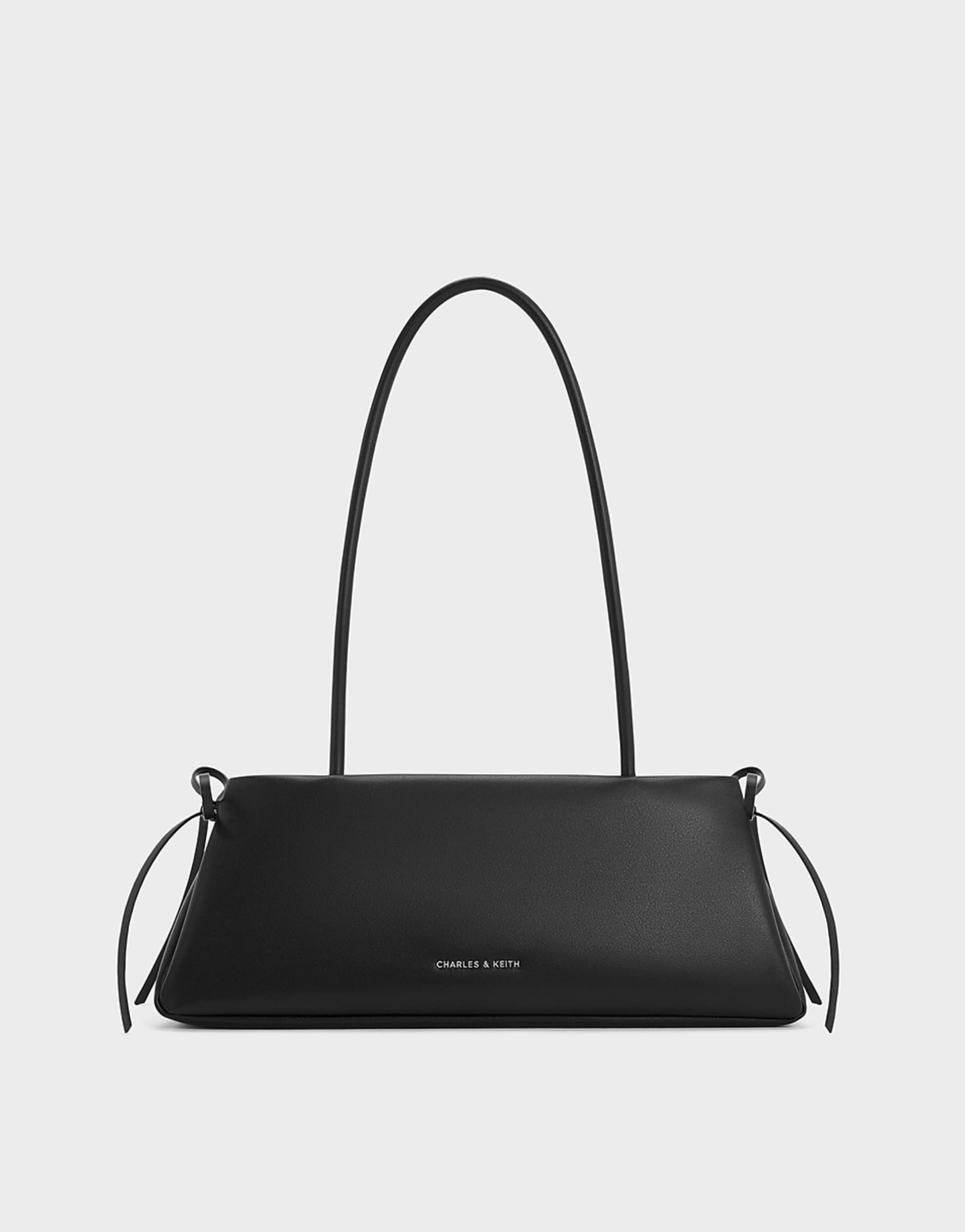 Charles &amp;amp; Keith Hazel Bow Elongated Trapeze Shoulder Bag in Noir