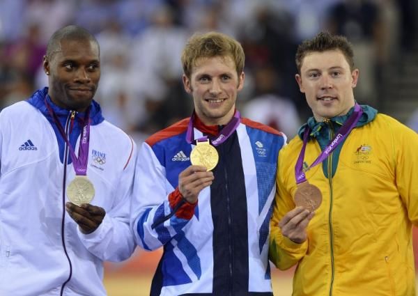 Britain's gold medalist Jason Kenny (C), France's silver medalist Gregory Bauge (L) and Australia's bronze medalist Shane Perkins (R) pose on the men's sprint podium