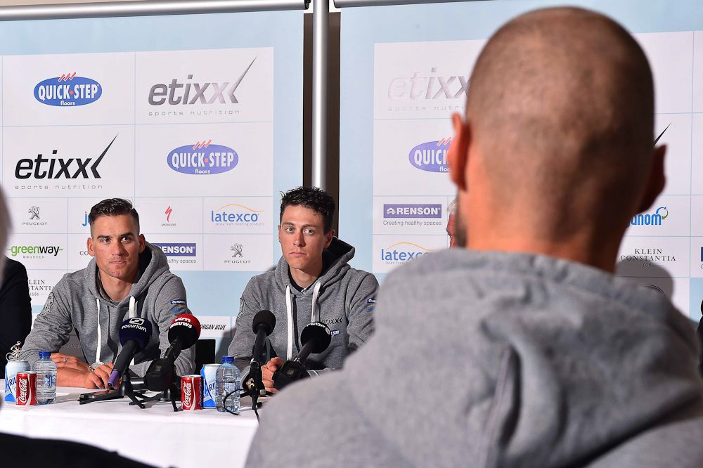 Boonen watches his teammates address the press.