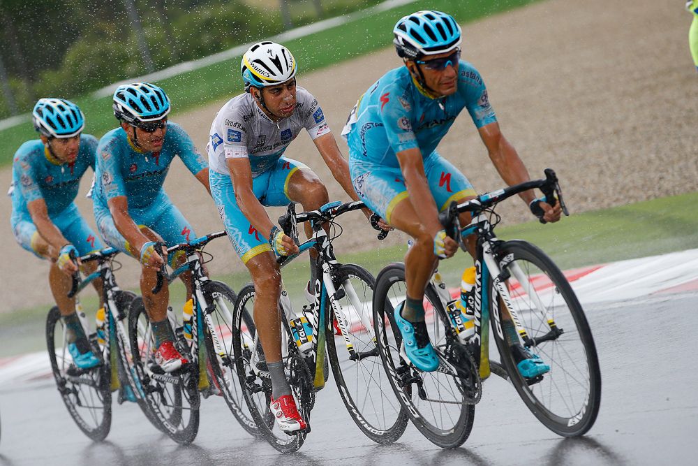 Fabio Aru surrounded by Astana teammates on the F1 track in Imola