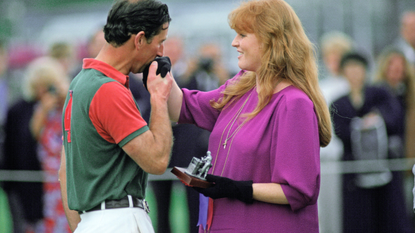 Prince Charles Kisses The Duchess Of York's Hand As She Presents Him With A Prize After A Polo Match At Windsor In Berkshire