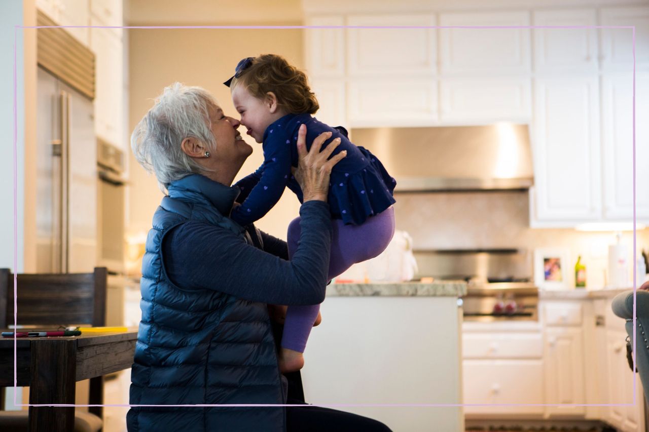 A grandmother playing with a toddler