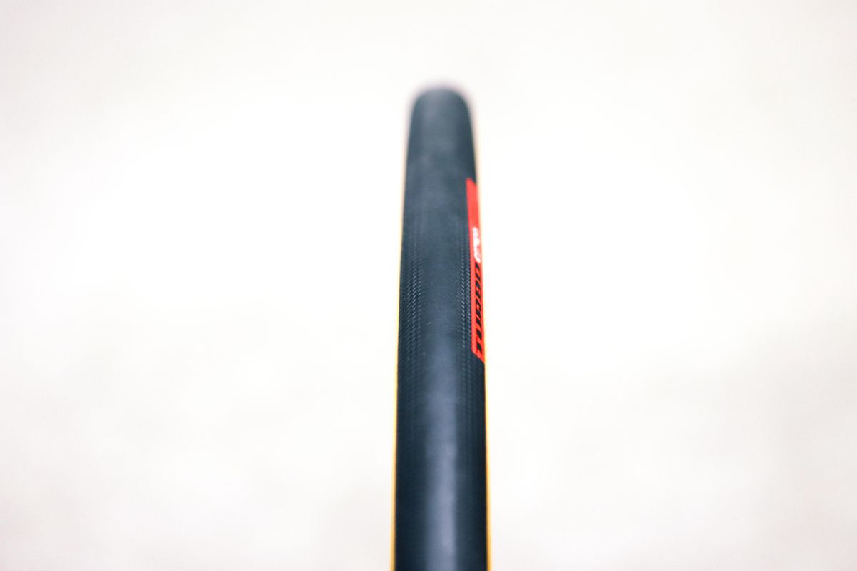 A tan bicycle tyre on a white background