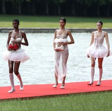 Gigi Hadid and models walk the runway during "Le Chouchou" Jacquemus' Fashion Show at Chateau de Versailles on June 26, 2023 in Versailles, France.