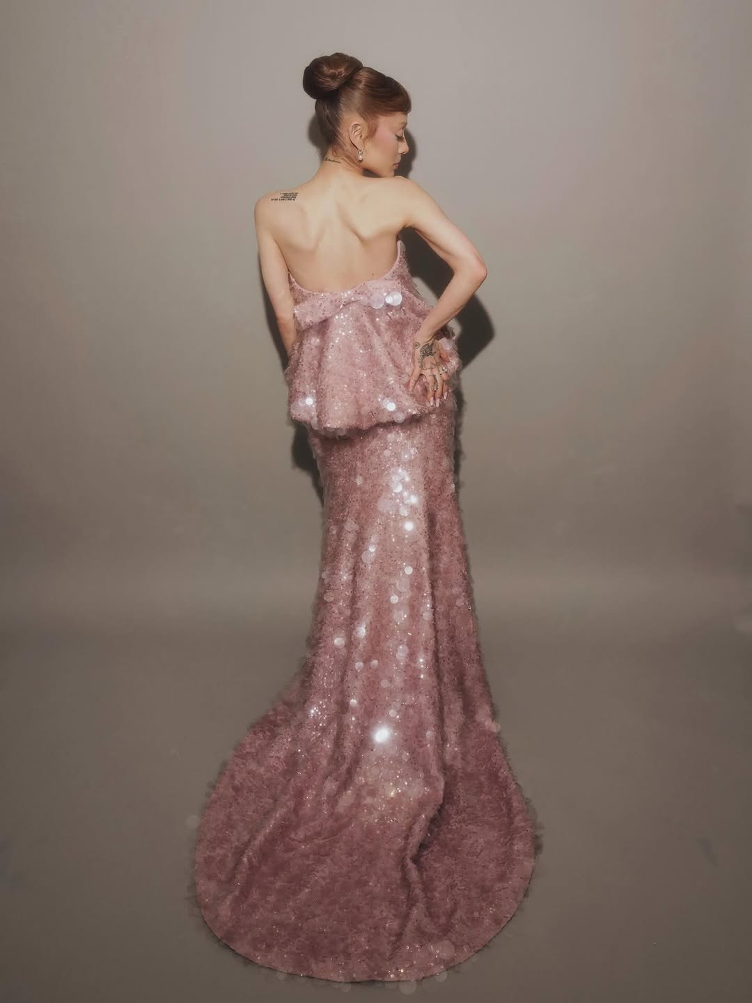 Ariana Grande wore a custom Balenciaga gown made of pink sequins on the Wicked: For Good press tour