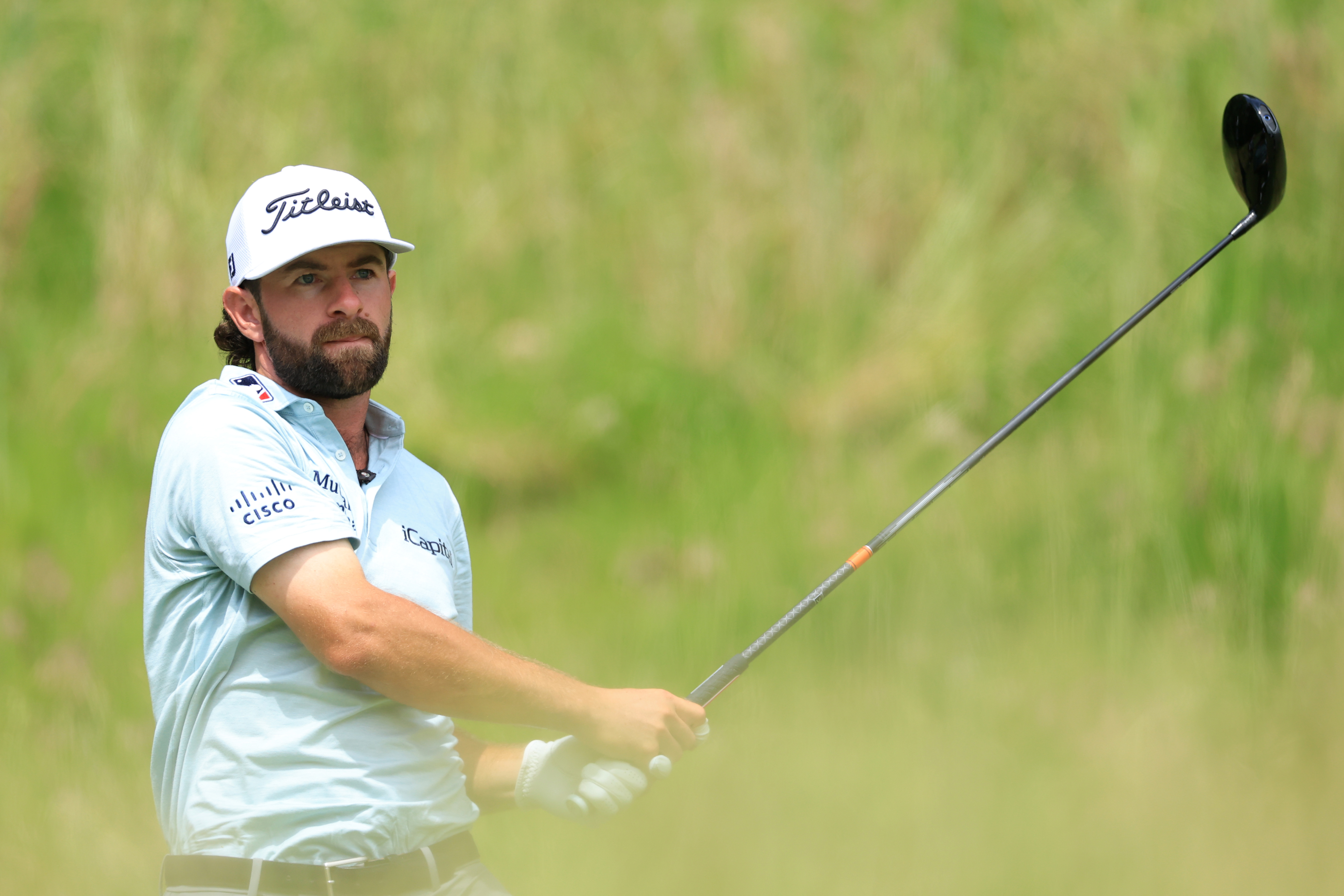 Cameron Young hits a tee shot with a driver