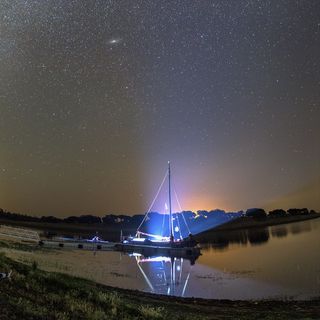 Milky Way, Andromeda Galaxy and Sem Fim. sailboat