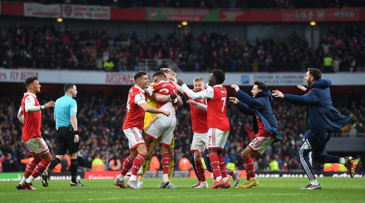 Arsenal players and staff celebrate on the pitch after Reiss Nelson scored their team&#039;s third goal during the Premier League match between Arsenal and AFC Bournemouth at the Emirates Stadium on 4 March, 2023 in London, United Kingdom.