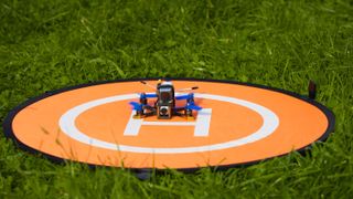 Best drone landing pad - drone on landing pad on grass