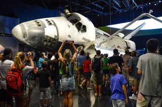 Guests view the space shuttle Atlantis at Kennedy Space Center Visitor Complex in Florida.