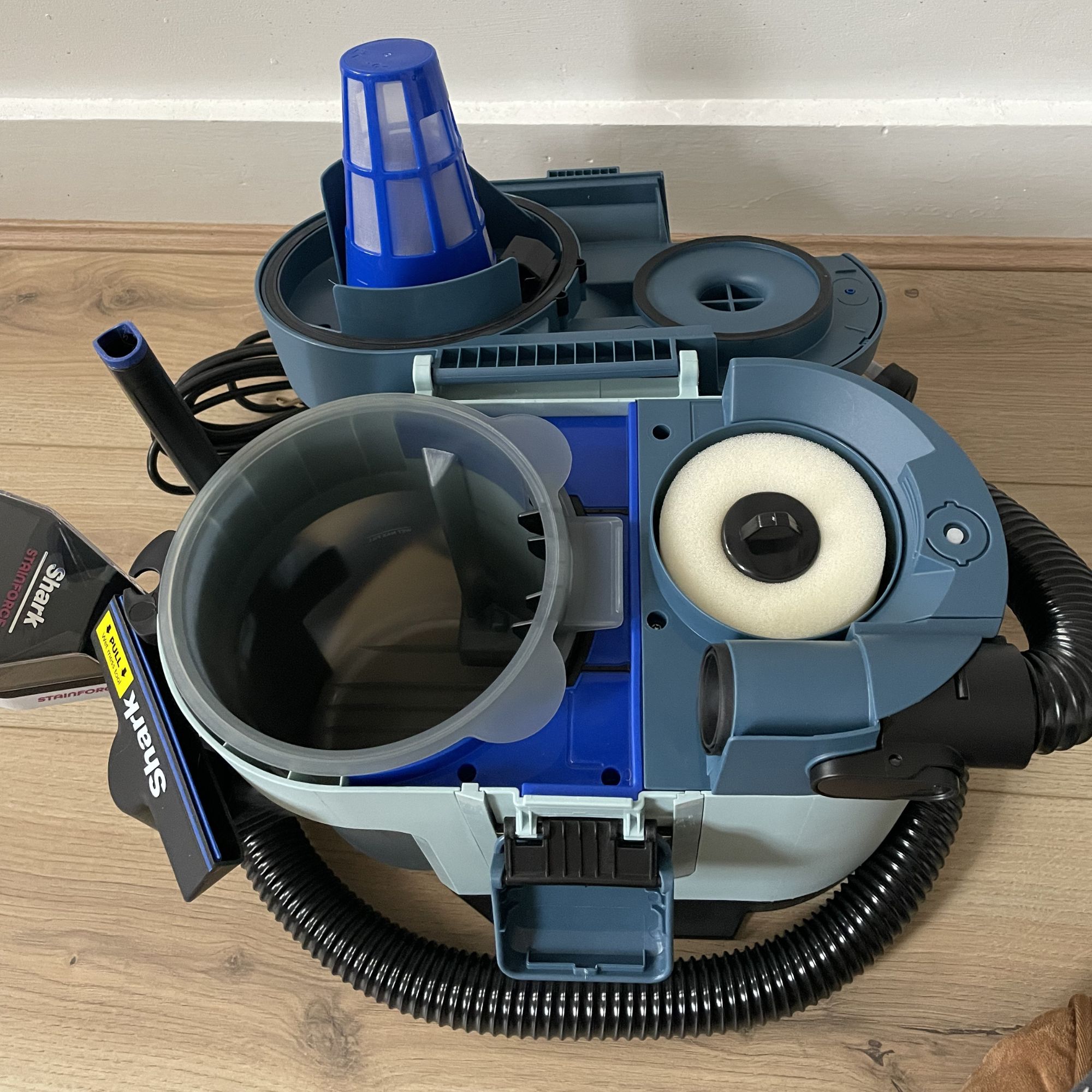 Inside of the main unit of the Shark EveryMess, showing the debris container and filter