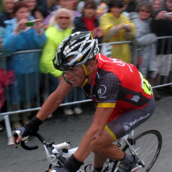Lance Armstrong (RadioShack) heads to the podium to say hello to French president Nicolas Sarkozy