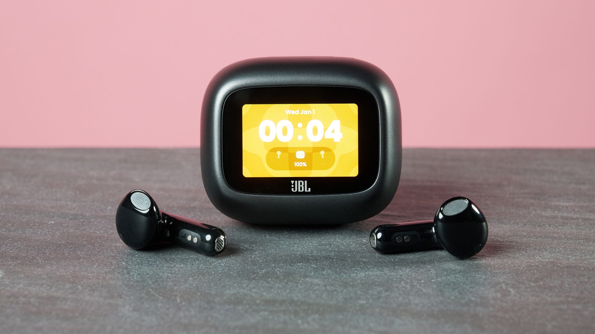 JBL Live Flex 4 on table with display on