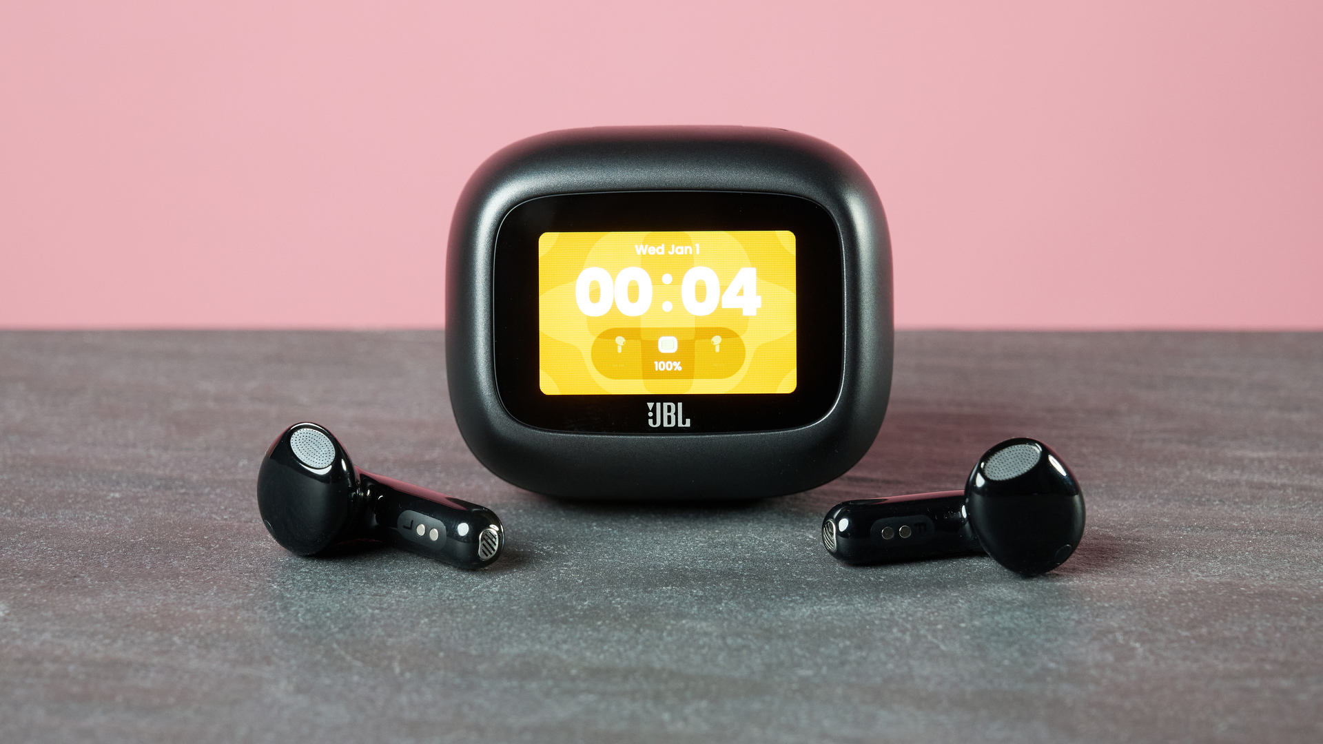 JBL Live Flex 4 on table with display on