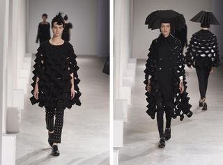 Two models in black 3D netting effect outfits, one with a black hat