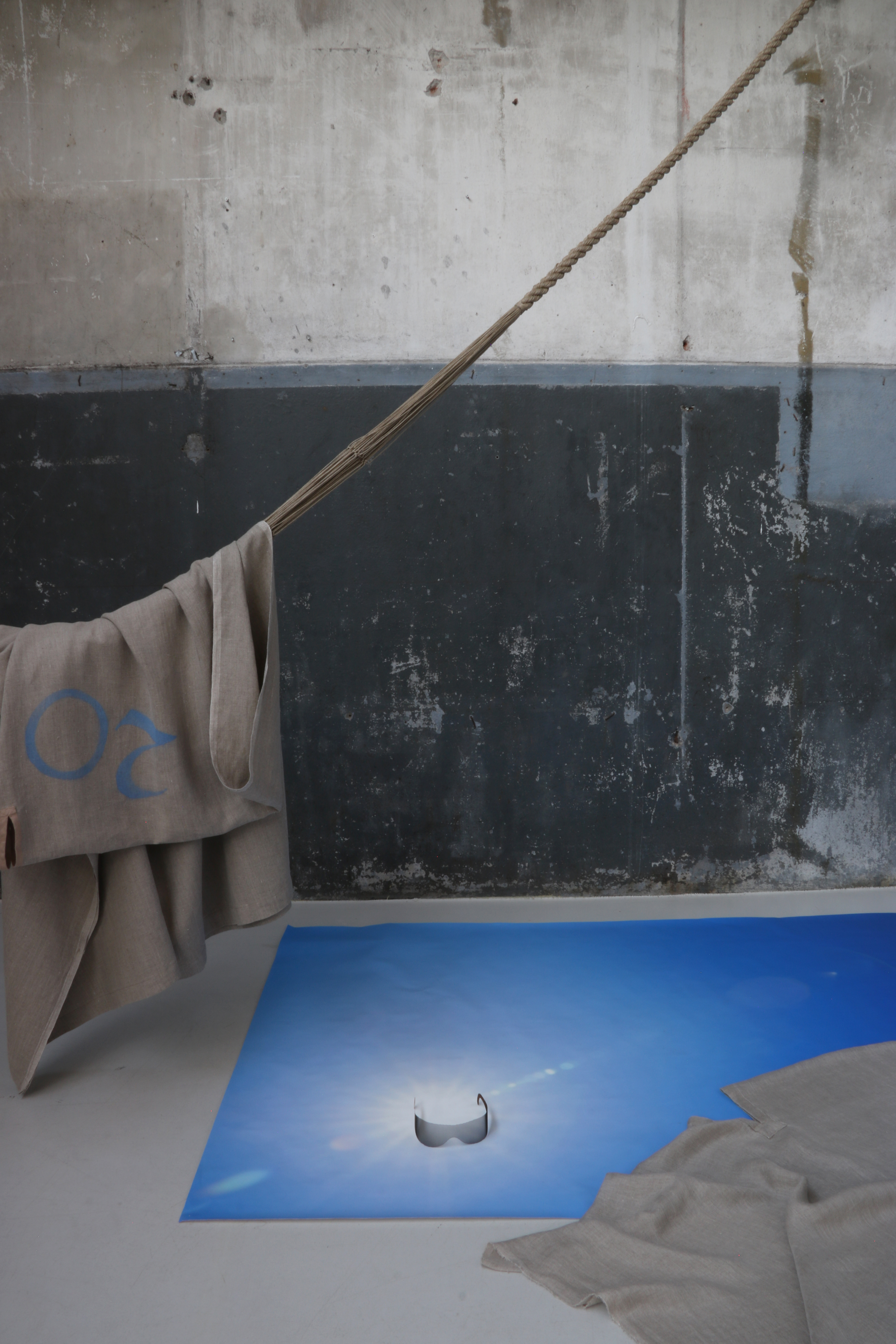 Exhibition view at Looiersgracht 60 featuring Sun+ sunglasses on the floor