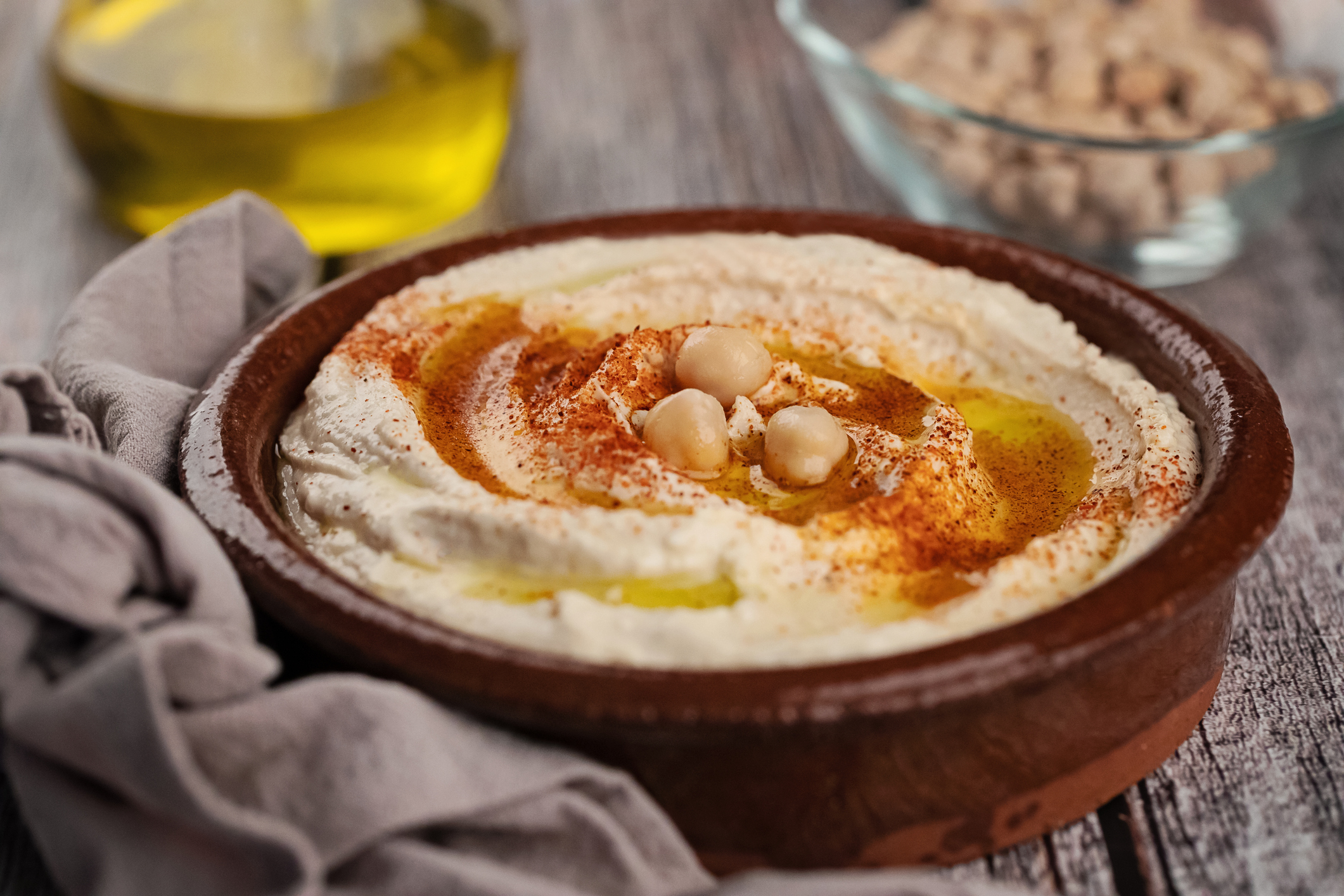 High angle view of hummus on wooden surface