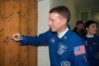 Expedition 42 Terry Virts and Traditional Door Signing Terry Virts and Traditional Door Signing