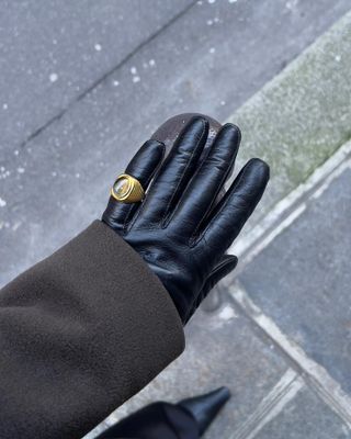 Sylvia Mus wearing leather gloves and a Daphine ring