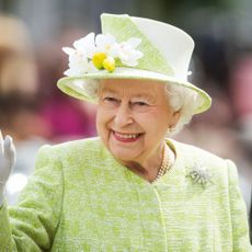 windsor, england april 21 queen elizabeth ii waves during a walk about around windsor on her 90th birthday on april 21, 2016 in windsor, england photo by samir husseinwireimage