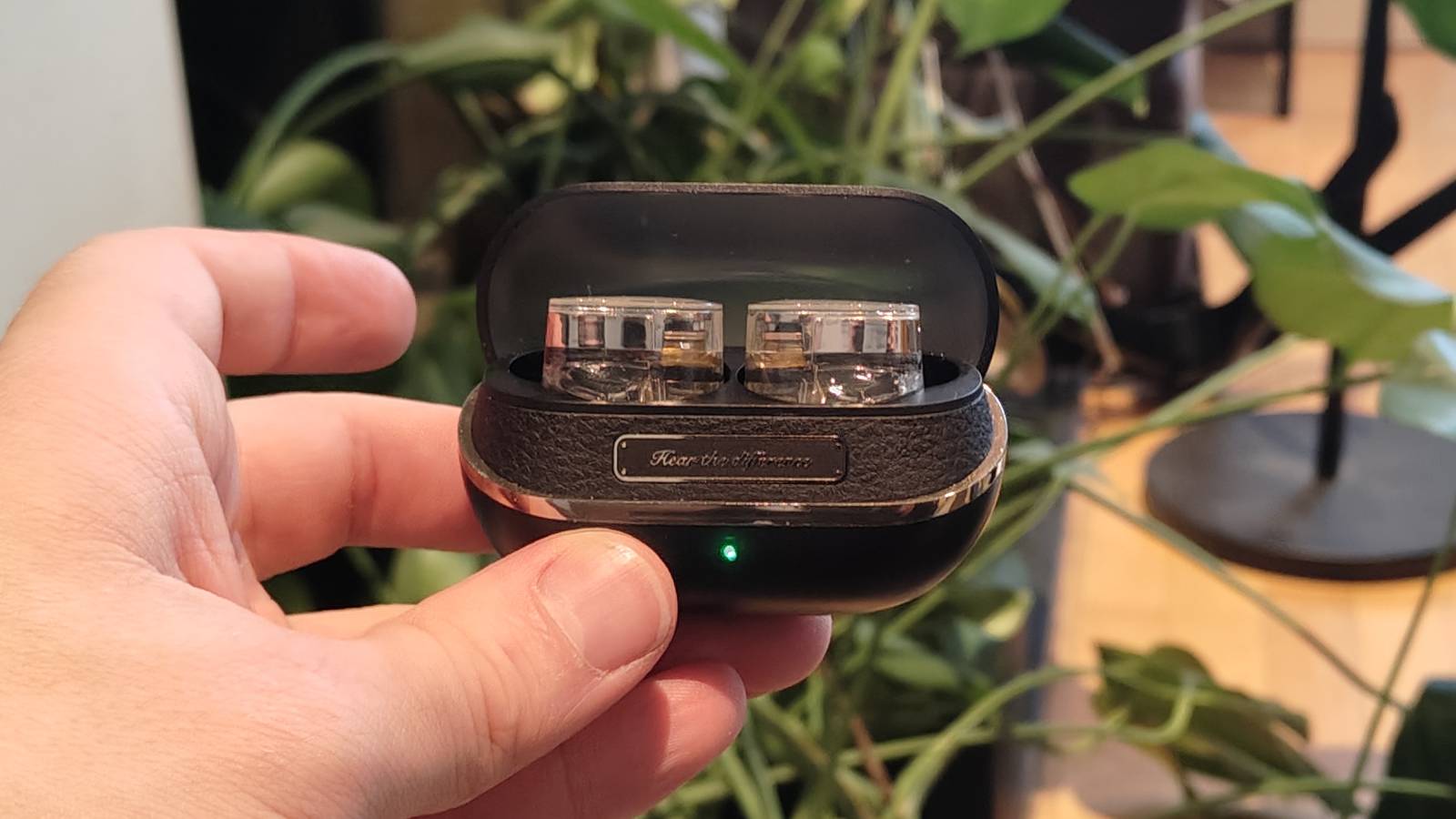 The Soundpeats H3 being held in a man&#039;s hand.