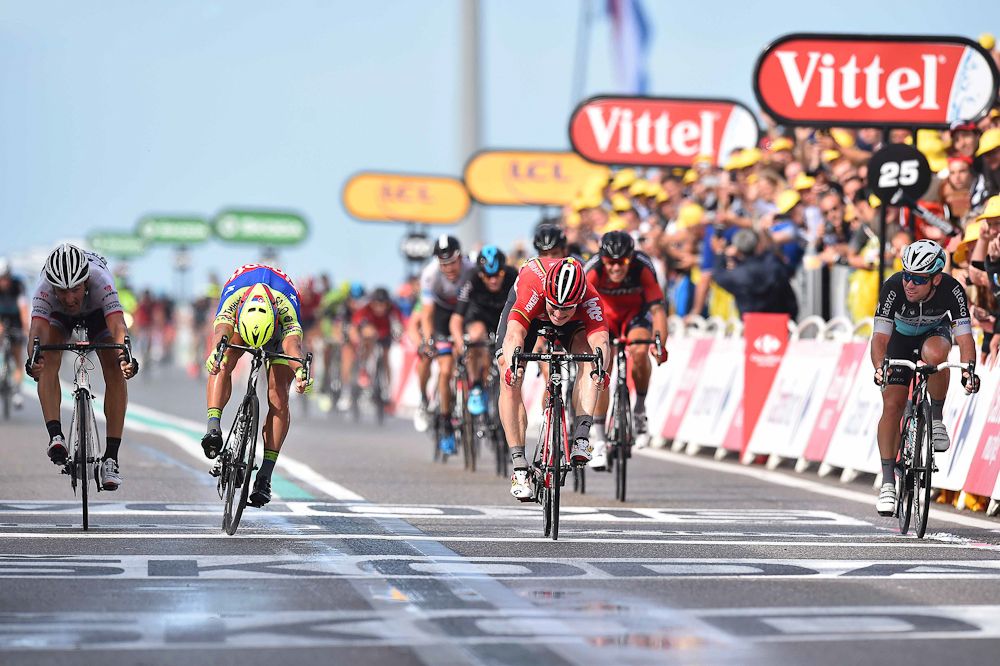 Andre Greipel wins stage 2 of the 2015 Tour de France by a bike throw over Peter Sagan.
