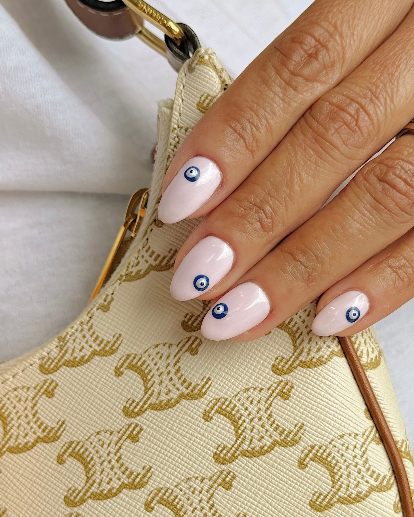 Evil eye accents simple nail design