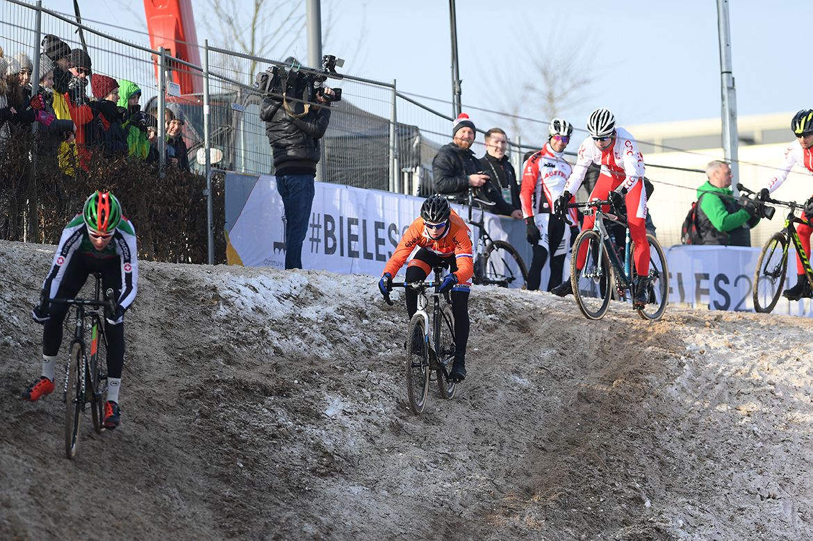 Riders take varying lines down into the off-camber