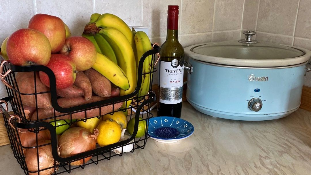 stackable fruit and veg baskets next to slow cooker to show small kitchen storage essentials