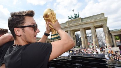 Mesut Ozil celebrates Germany's World Cup triumph