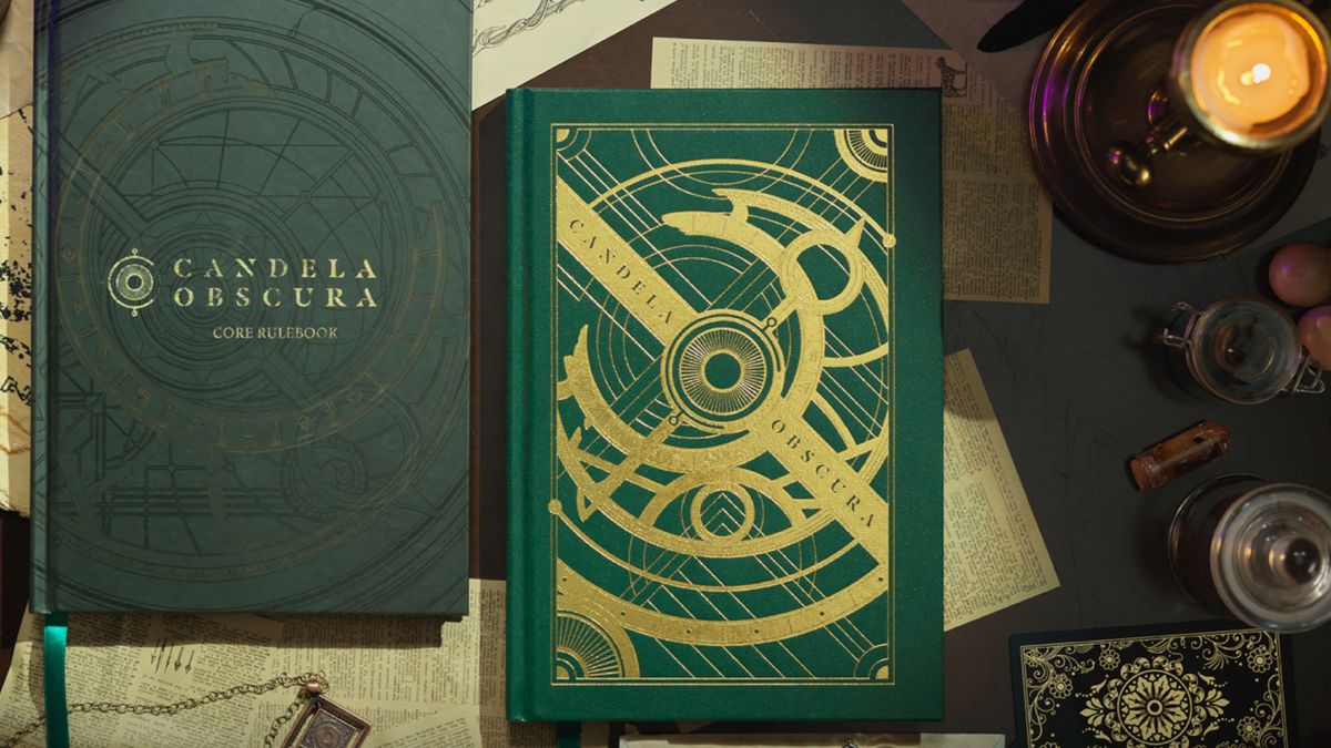 Two copies of the Candela Obscura rulebook on a desk strewn with esoteric items and a candle