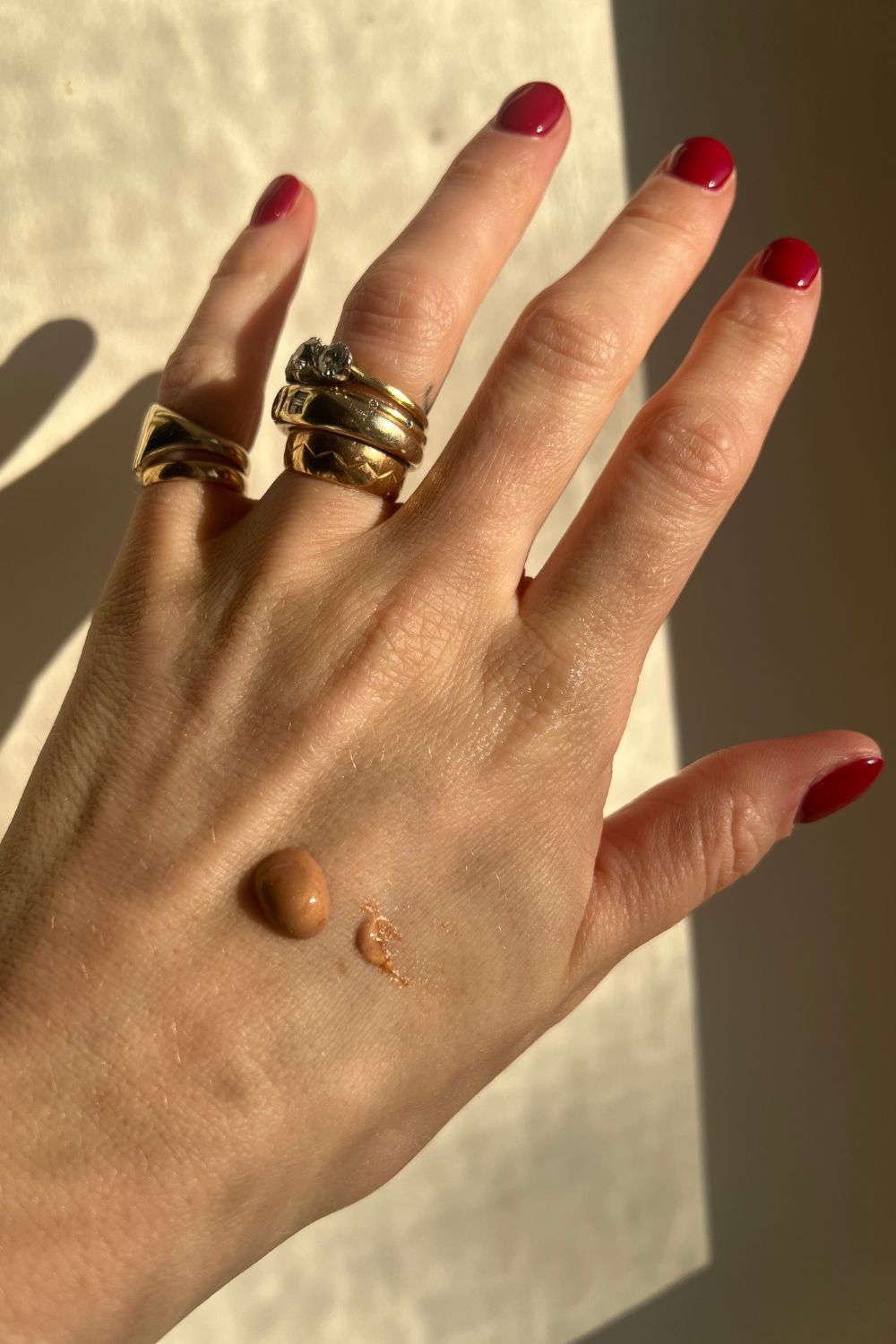 Photo of the golden shadow on the back of Katie's hand