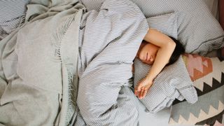 girl sleeping in bed by getty images