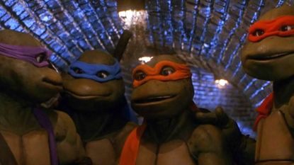 Donatello, Leonardo, Michelangelo, and Raphael standing in the sewer