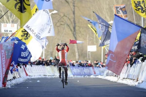 Pawel Szczepaniak (Poland) grabbed a flag from a fan and waved it as he rode to the line for the win.