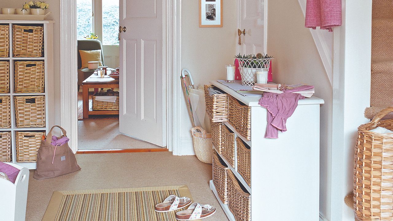 A hallway with wicker storage baskets