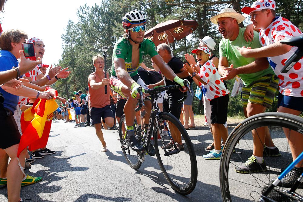 Peter Sagan is followed by a fan during stage 14.
