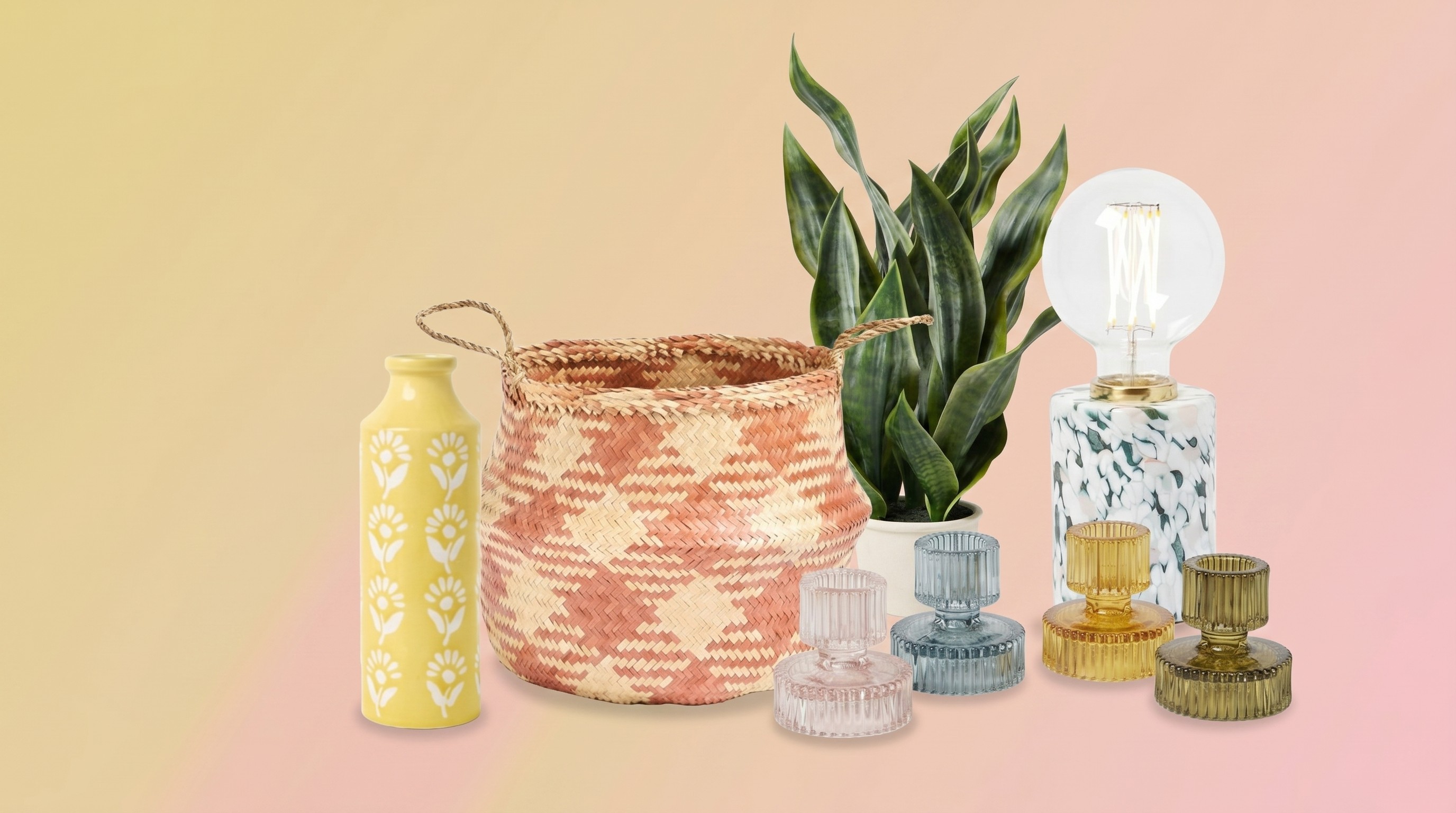Oliver Bonas home decor on a pale pink and gold background.