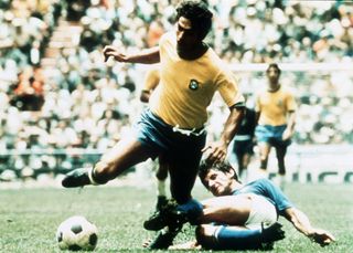 Brazil's Rivellino is tackled late by an Italian defender in the 1970 World Cup final.