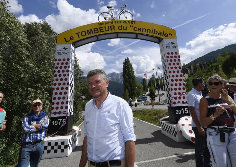 Bernard Th&eacute;venet with the monument on Pra Loup to commemorate his victory on the mountain 40 years ago