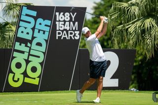 Richard Bland hits a tee shot at a LIV Golf tournament