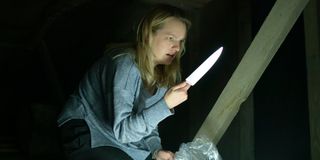 Elisabeth Moss holding a knife in The Invisible Man