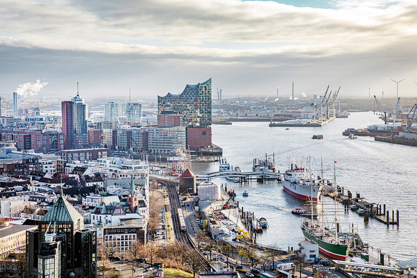 the Elbphilharmonie in Hamburg, by the water on a cloudy day