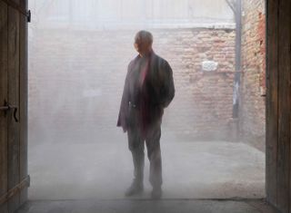 Axel Vervoordt immersed in a fog installation