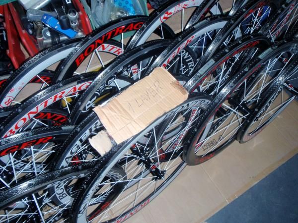 The first layer of rim cement is left to cure overnight before a second is applied to the team's tubular wheels